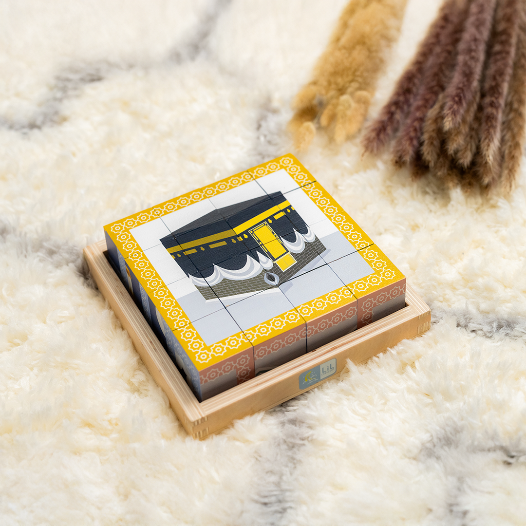 Close-up of the Kaaba scene from the Lil Crescent 6-in-1 Muslim Cube Puzzle showing the wooden border guide frame — Islamic educational toy FSC-certified wood