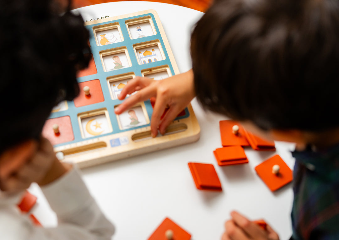 Close-up of Lil Crescent Muslim Memory Game Islamic illustrated cards showing mosque, Quran and crescent moon themes — faith-based preschool matching game
